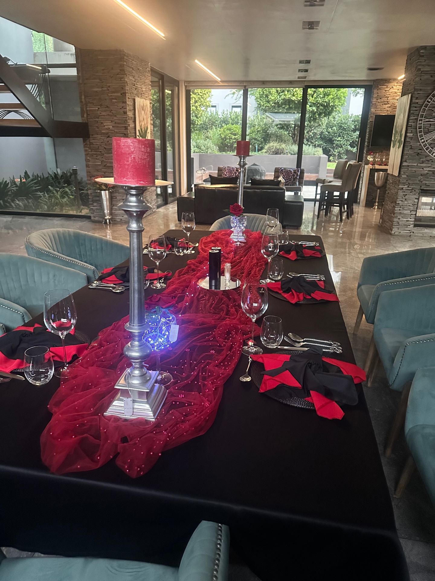A candlelit dinner table set for a private cooking and dining evening