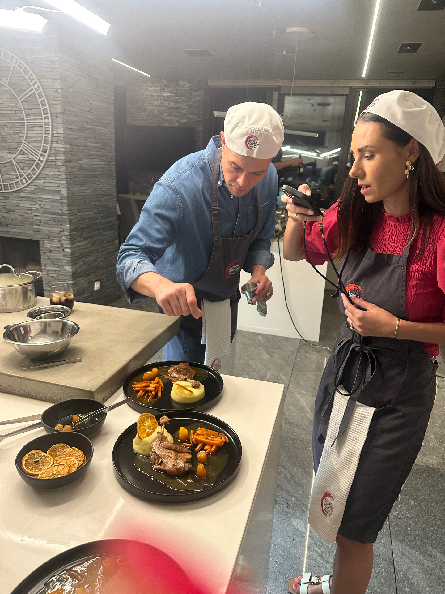 Guests cooking at a Kitchen Addiction class