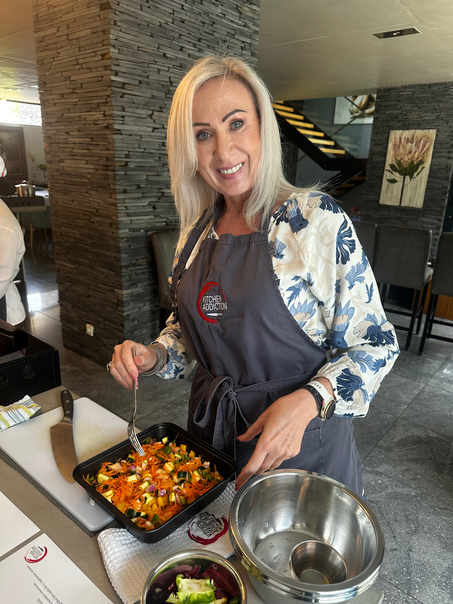 Guests cooking at a Kitchen Addiction class